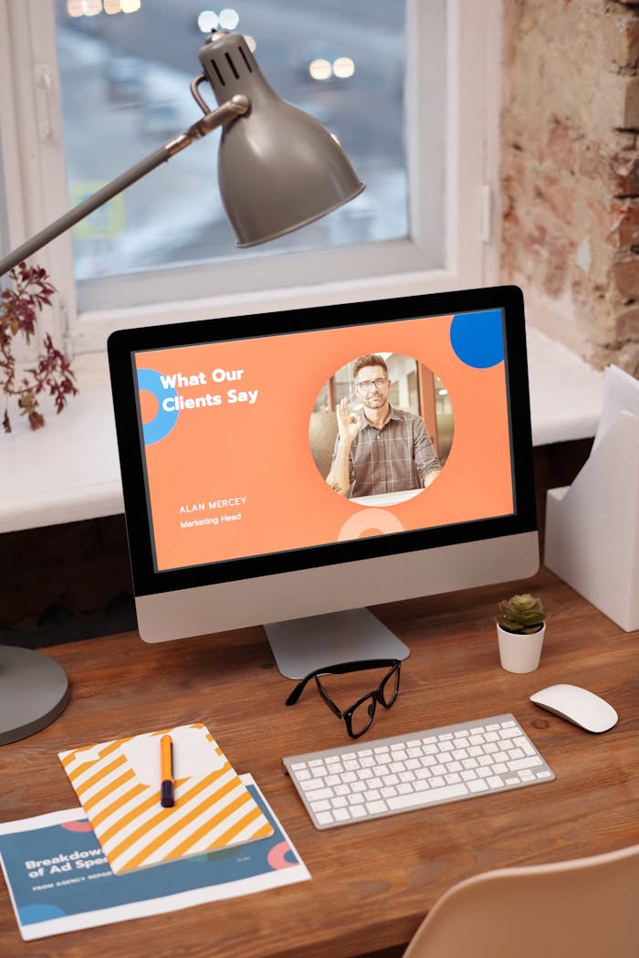 services-06 Stylish home office setup with computer showcasing client testimonials.